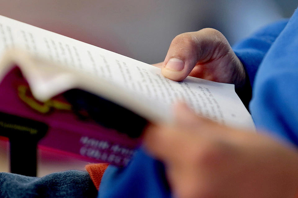 Child reading Goosebumps book