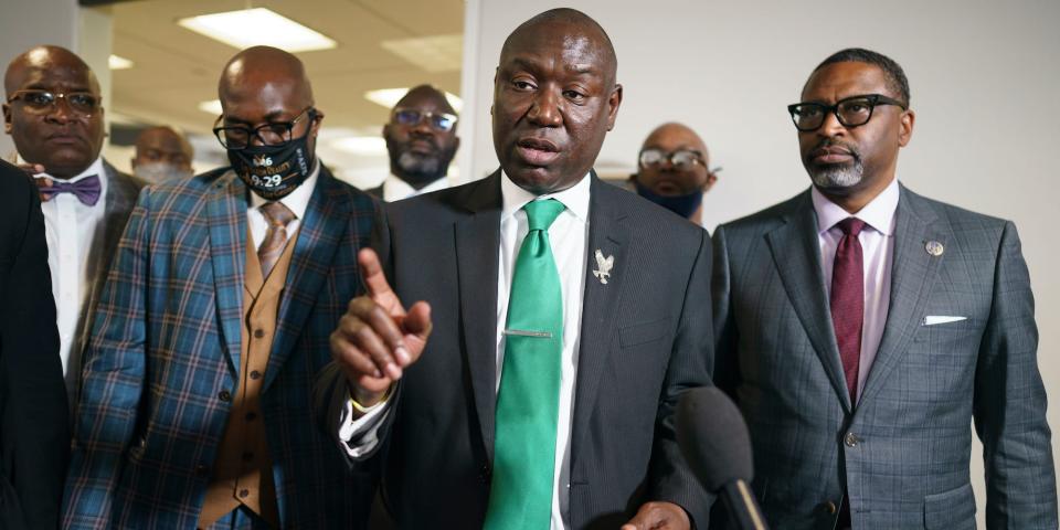 Benjamin Crump, center, the civil rights attorney representing the family of George Floyd, joined at right by NAACP President Derrick Johnson, speaks to reporters after they met with Sen. Cory Booker, D-N.J., about police reform legislation, at the Capitol in Washington, Tuesday, May 25, 2021