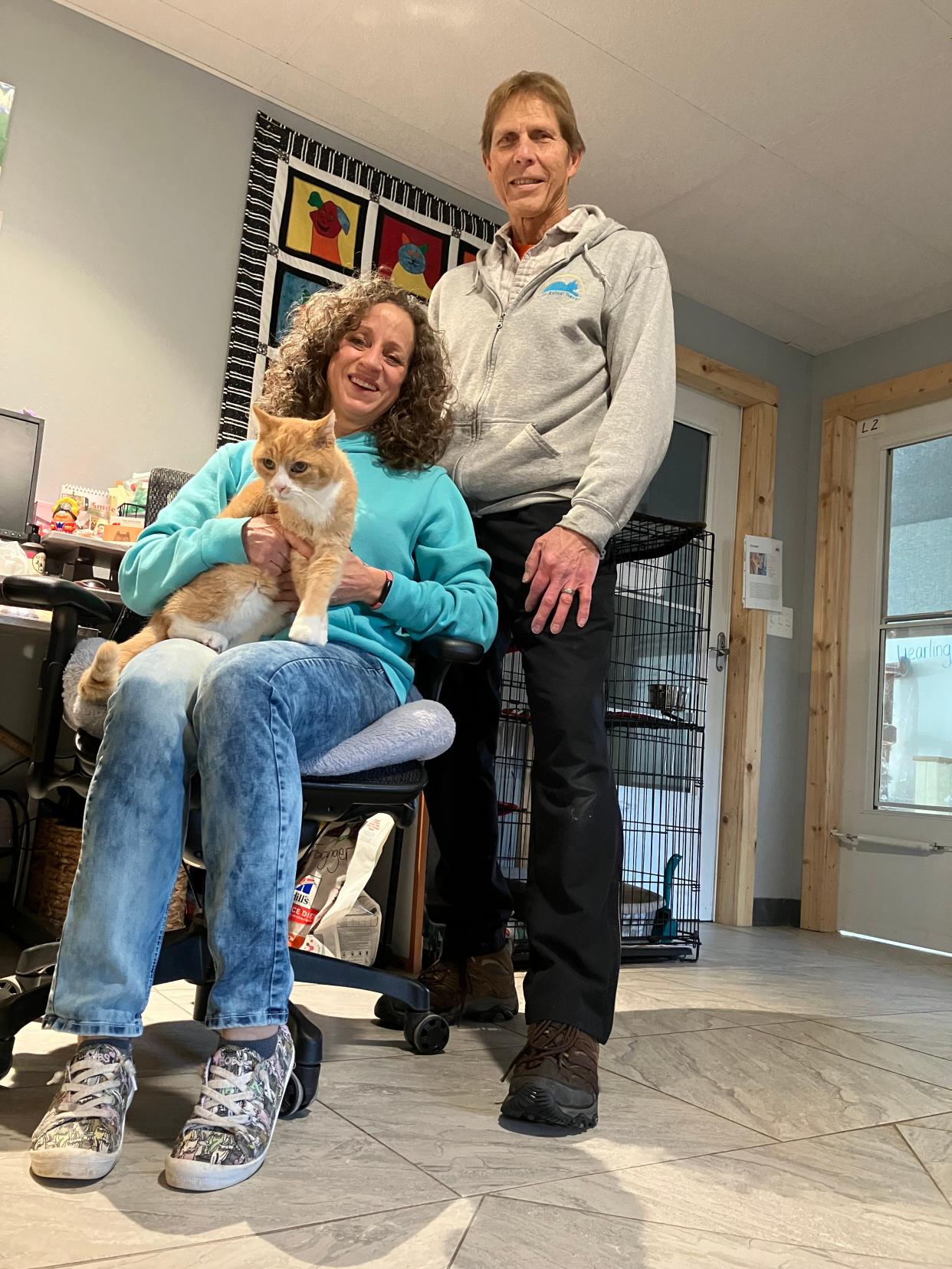 Leslie Sawyer and Bill Stoll, founders of Eden Animal Haven, pose for a photo with Eirik, a cat who is one of the longest residents at the shelter.