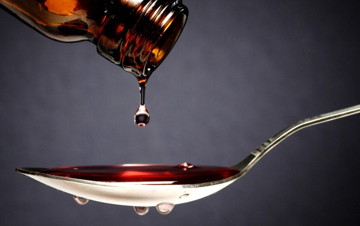 Pouring medication or antipyretic syrup into spoon