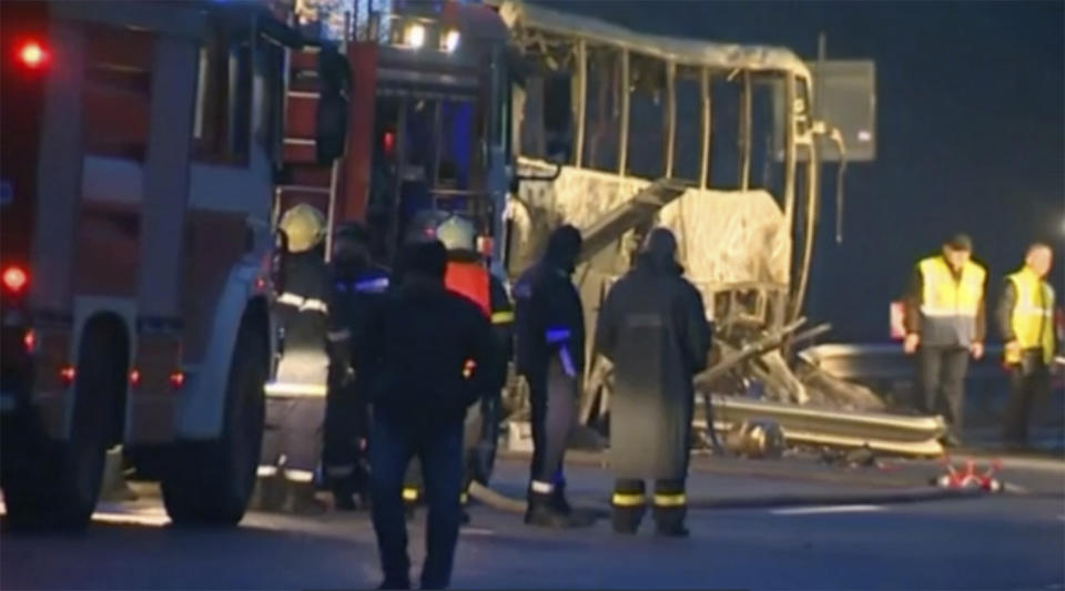 In this image made from video provided by Nova TV, a burnt out bus is seen after a crash in Bosnek, Bulgaria, Tuesday, Nov. 23, 2021. A bus crash in western Bulgaria early Tuesday has killed dozens of people, authorities said. (Nova TV via AP)