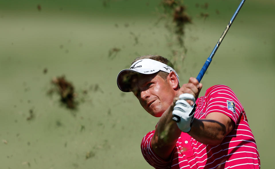 ATLANTA, GA - SEPTEMBER 22: Luke Donald of England watches his approach shot on the fourth hole during the third round of the TOUR Championship by Coca-Cola at East Lake Golf Club on September 22, 2012 in Atlanta, Georgia. (Photo by Scott Halleran/Getty Images)