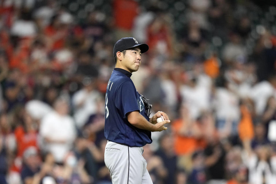 Seattle Mariners starting pitcher Yusei Kikuchi reacts after giving up a home run to Houston Astros' Yuli Gurriel during the third inning of a baseball game Friday, Aug. 20, 2021, in Houston. (AP Photo/David J. Phillip)