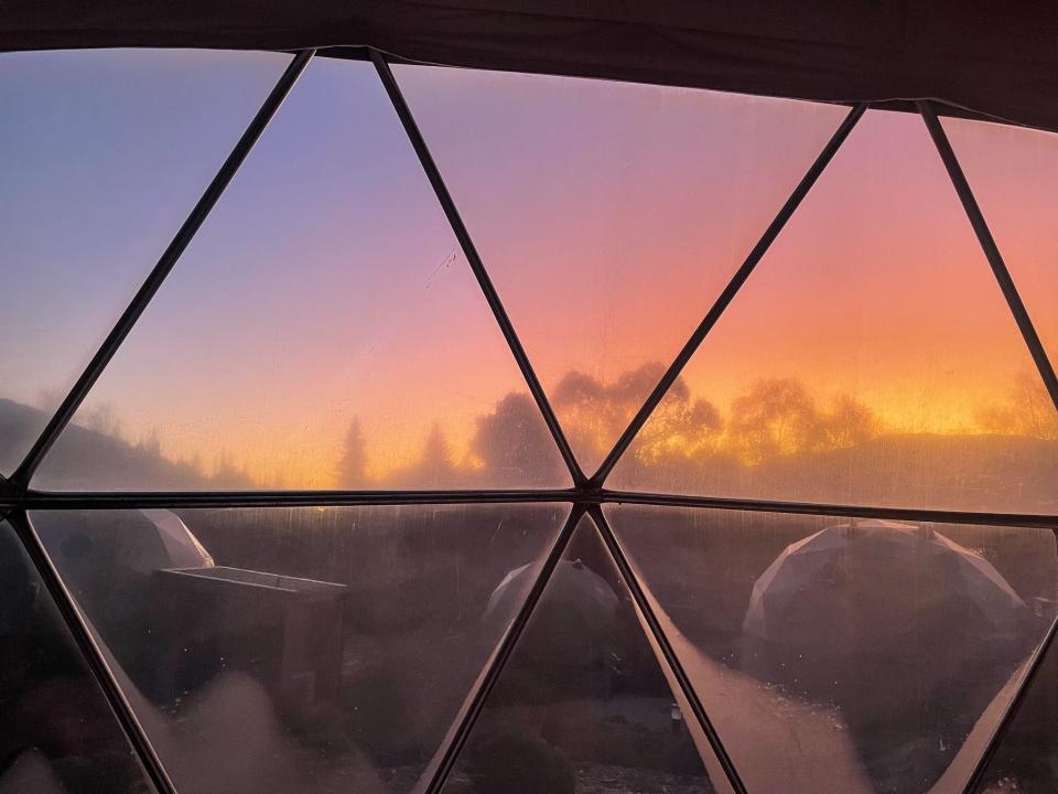 A view of the sunrise from the bed in the dome.