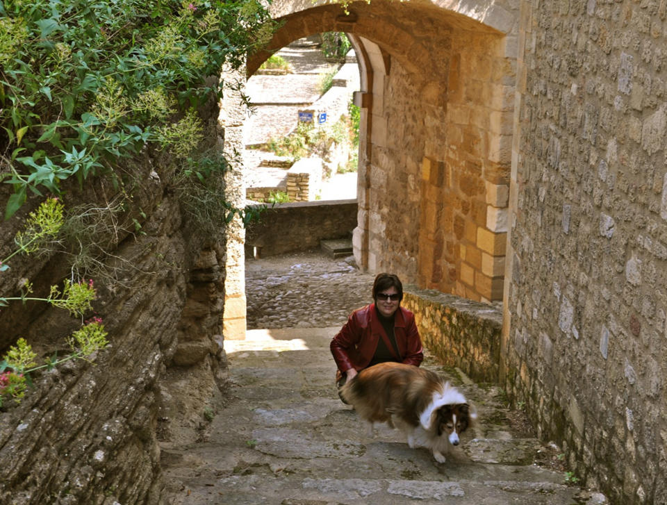 In this May 2011 photo provided by Sheron Long, Chula, a 30-pound Shetland sheepdog and veteran traveler, explores Provence with her owner, Sheron Long in Maubec, France. Travel for humans during holidays is tough enough: Long lines, crowds everywhere, extra bags full of presents. Throw a pet in the mix, and it's a recipe for disaster. Long is the author of "Dog Trots Globe - To Paris and Provence." (AP Photo/Sheron Long, Robert Long)