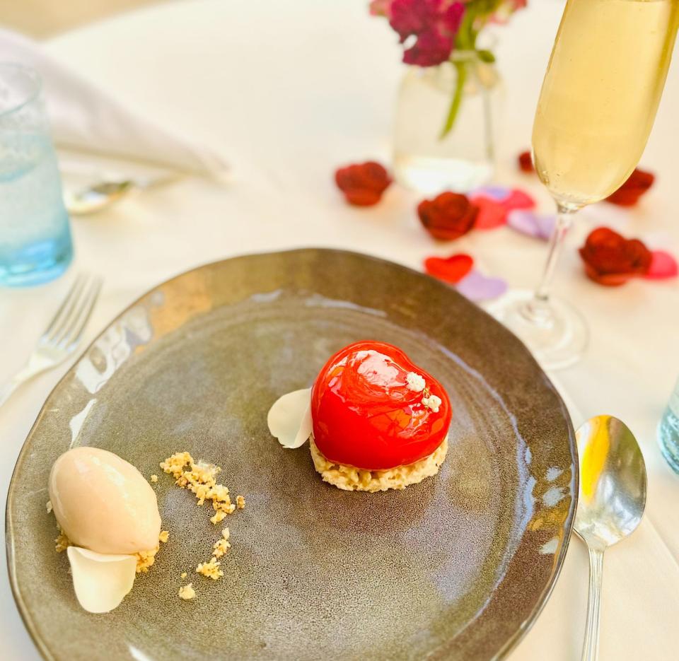 Le Bilboquet's Valentine's Day dessert pairs the sweetness of cherry with the tartness of lychee, served with white chocolate mousse and a pistachio biscuit.