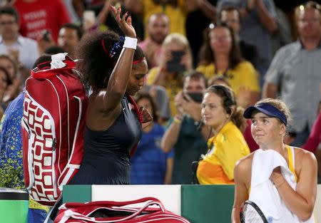 2016 Rio Olympics - Tennis - Preliminary - Women's Singles Third Round - Olympic Tennis Centre - Rio de Janeiro, Brazil - 09/08/2016. Serena Williams (USA) of USA waves and leaves next to Elina Svitolina (UKR) of Ukraine after losing their match. REUTERS/Kevin Lamarque