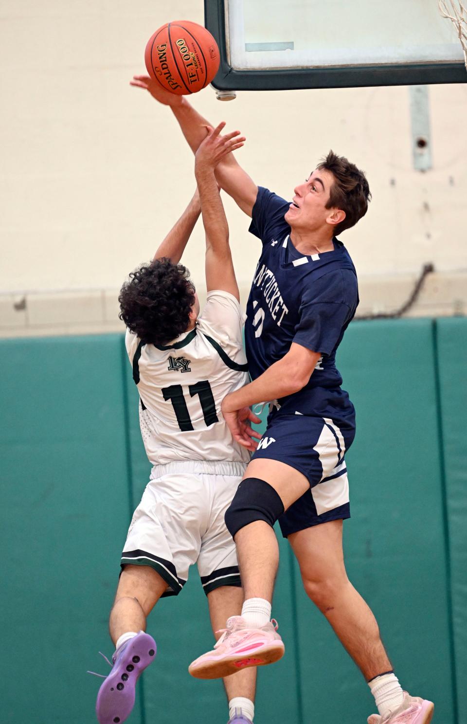 Jack Halik of Nantucket blocks a shot by Jose Gonzalez of Dennis-Yarmouth.