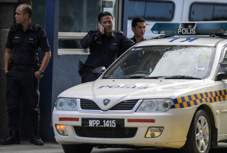 Malaysian Police man the main gate of the forensic wing at the Hospital Kuala Lumpur on February 17, 2017, where the body of a North Korean man suspected to be Kim Jong-Nam, half-brother of North Korean leader Kim Jong-Un, is being kept