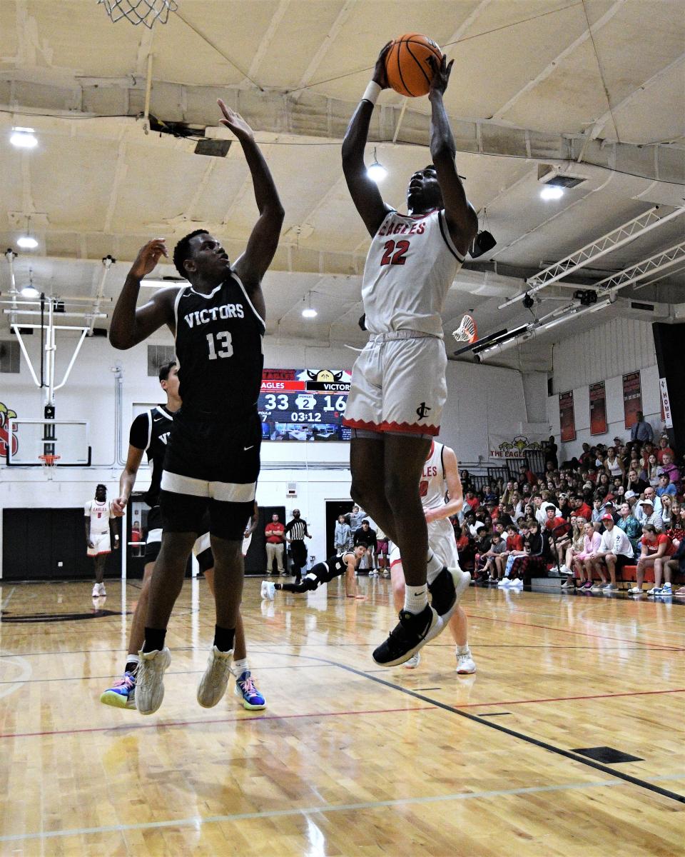 Jupiter Christian's Collin Paul goes up for a layup during the first half of the Eagles' regional quarterfinals win over Miami Christian. Paul led the team with 22 points in the victory (Feb. 16, 2023).