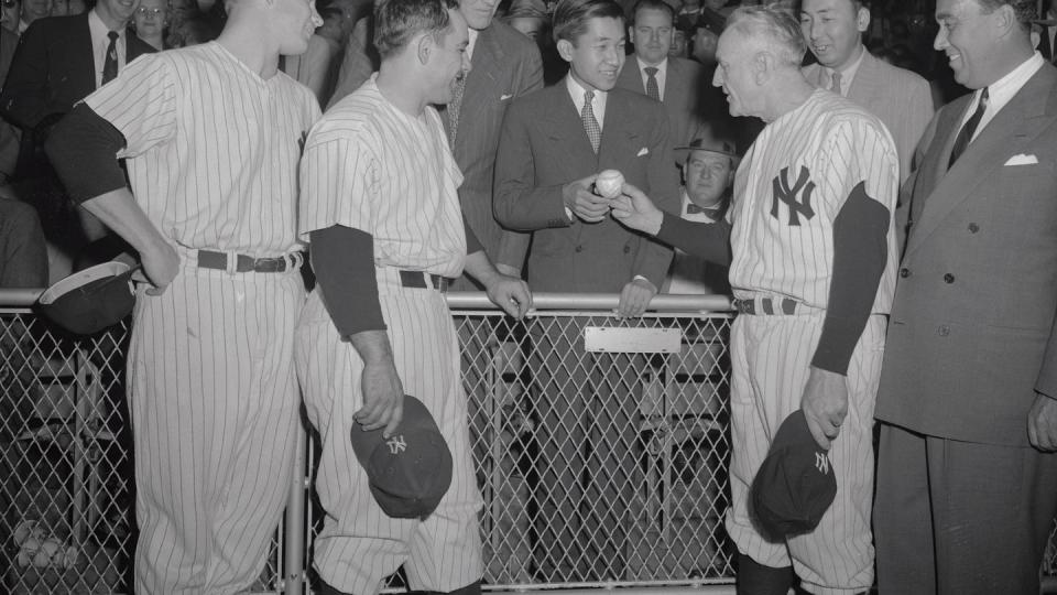 crown prince akihito receiving customary yankee baseball