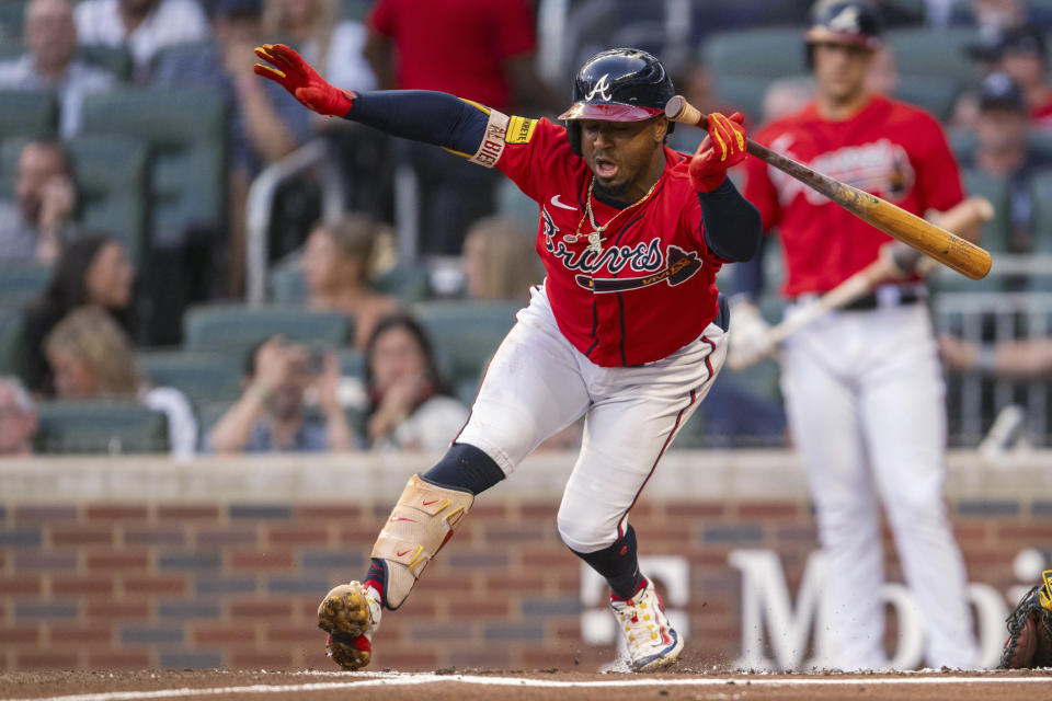 Atlanta Braves' Ozzie Albies avoids a pitch during the second inning of the team's baseball game against the Pittsburgh Pirates, Friday, Sept. 8, 2023, in Atlanta. (AP Photo/Hakim Wright Sr.)