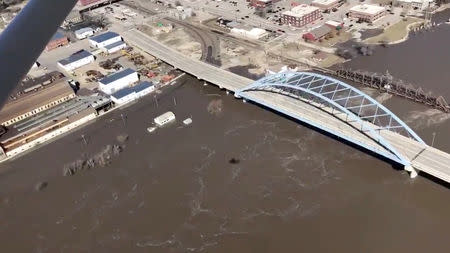 The Kansas side of the Missouri River is seen in Atchison, Kansas, U.S., March 22, 2019 in this still image taken from a video obtained from social media. SHAWN RIZZA/via REUTERS