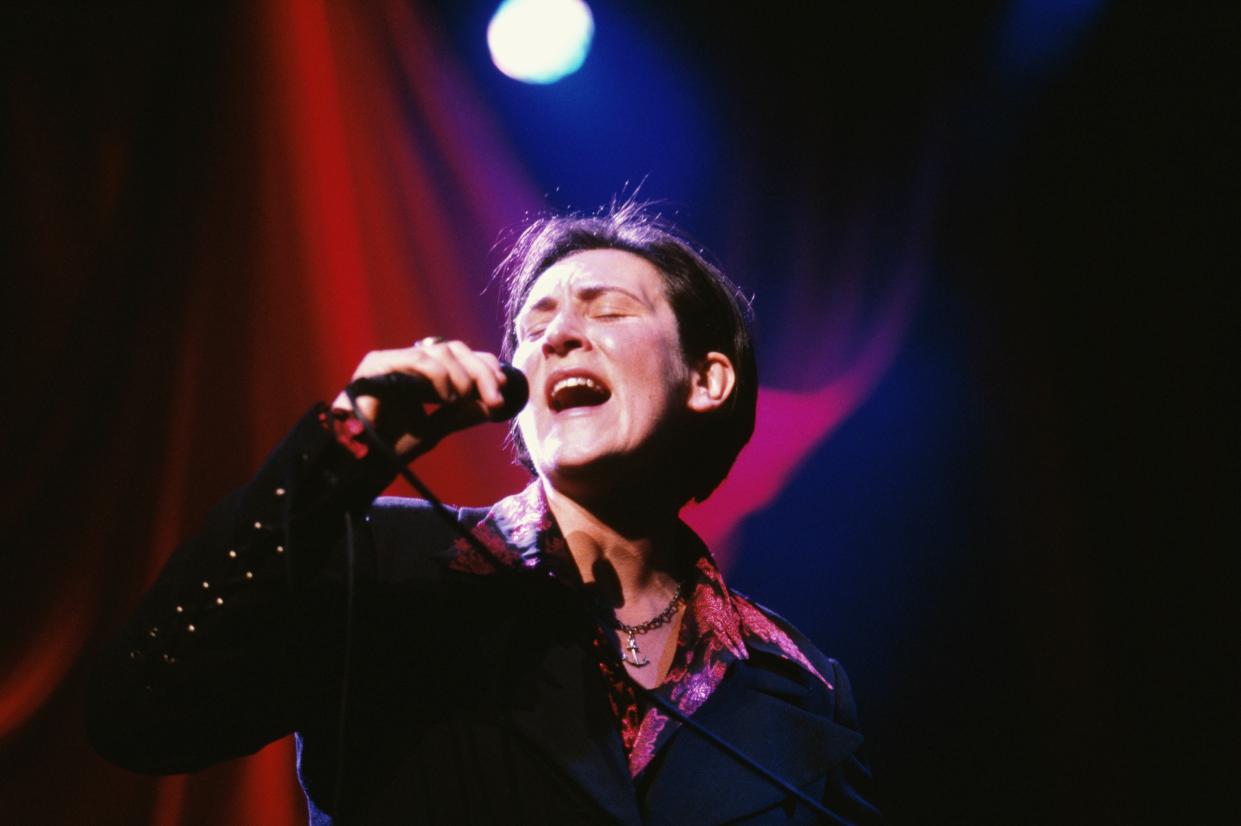 kd lang singing on stage in 1997.  (Photo by Mick Hutson/Redferns)