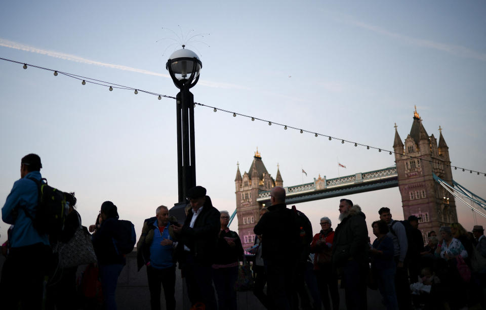 People by the Tower Bridge in London, UK. The FTSE was slightly up on Wednesday