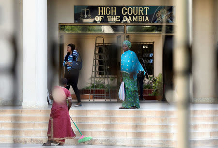 People are seen as they stand in the yard of the Gambian high court in Banjul, Gambia December 5, 2016. REUTERS/Thierry Gouegnon