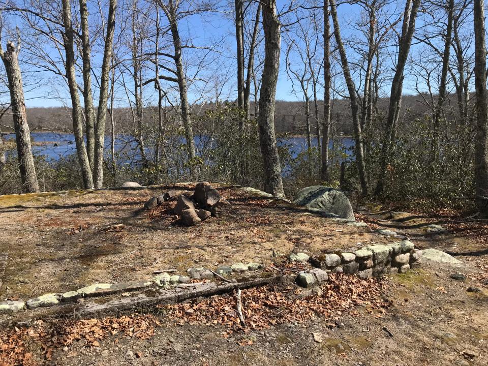 A rectangular stone foundation, probably for a cabin, can be seen on the banks overlooking Blue Pond.