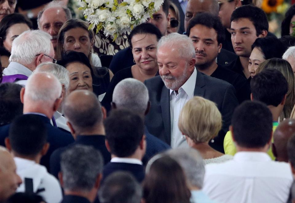 Brazilian president Lula stands beside Pele’s open casket (REUTERS)