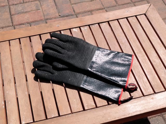 <p>Serious Eats / Jesse Raub</p> Just a few minutes in the sun made the exterior of rubber grill gloves hot—so be careful about even where you store/place them (and about removing them).