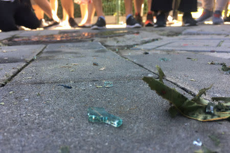 Broken glass is seen near the U.S. embassy in Beijing, China July 26, 2018. REUTERS/Jason Lee