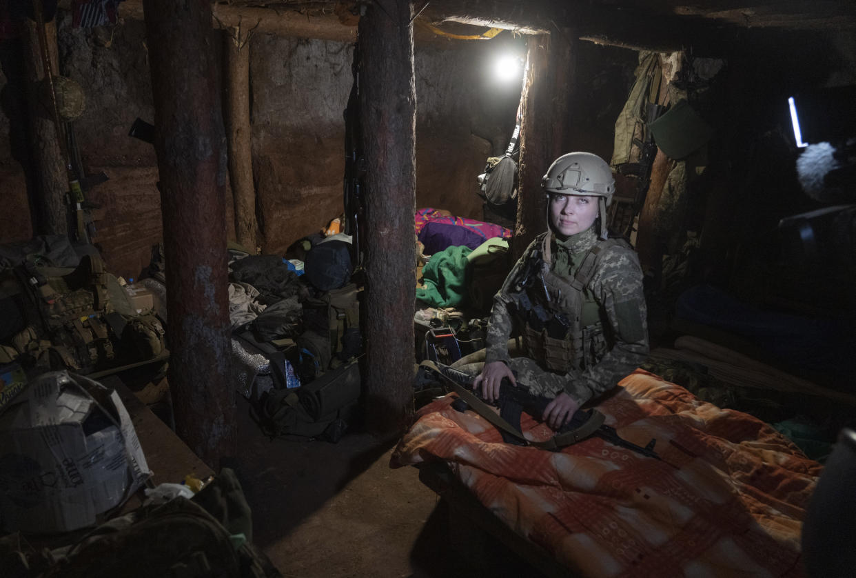 Ukrainian platoon commander Mariia rests in a trench in a position in the Donetsk region, Ukraine, Saturday, July 2, 2022. (AP Photo/Efrem Lukatsky)