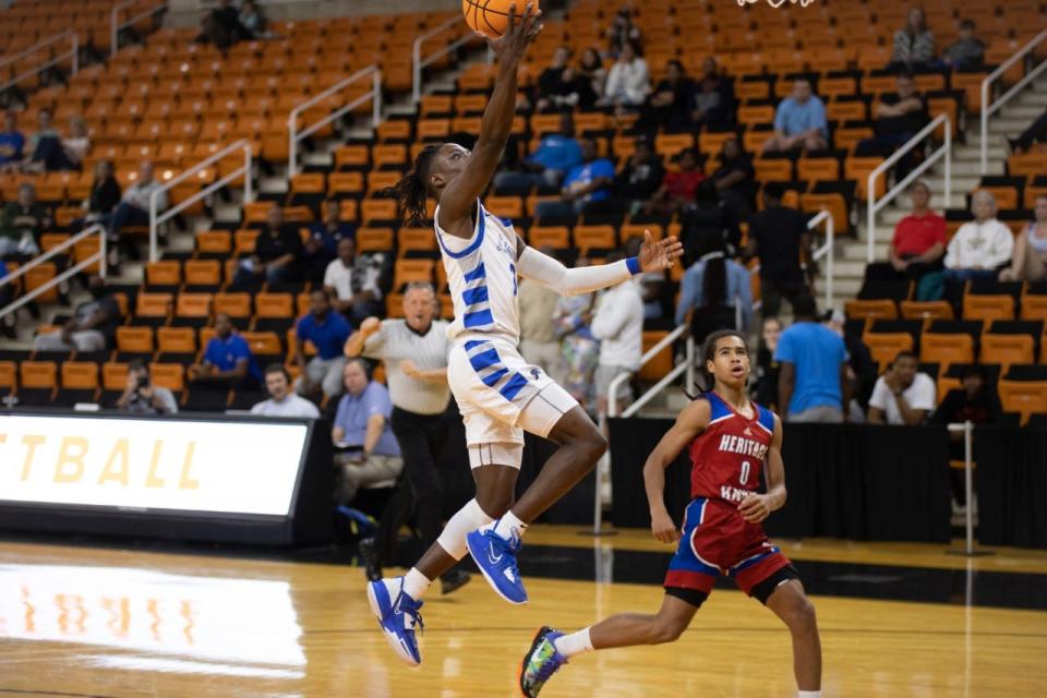 St. Andrew's senior Zyere Edwards drives in for a layup in the Lions' win over Heritage Saturday.