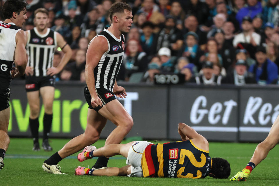 ADELAIDE, AUSTRALIA - AUG 17: Dan Houston of the Power crunches Izak Rankine of the Crows during the 2024 AFL Round 23 match between the port Adelaide Power and the Adelaide Crows at Adelaide Oval on August 17, 2024 in Adelaide, Australia. (Photo by James Elsby/AFL Photos via Getty Images)