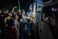 TUGUEGARAO, PHILIPPINES - NOVEMBER 16: Residents affected by Typhoon Vamco queue to receive free meals on November 16, 2020 in Tuguegarao, Cagayan province, Philippines. The Cagayan Valley region in northern Philippines saw its worst flooding in 48 years after a dam released massive amounts of rainwater brought about by Typhoon Vamco. The country continues to reel from the widespread destruction caused by this year's deadliest cyclone which has killed at least 67 people. (Photo by Ezra Acayan/Getty Images)