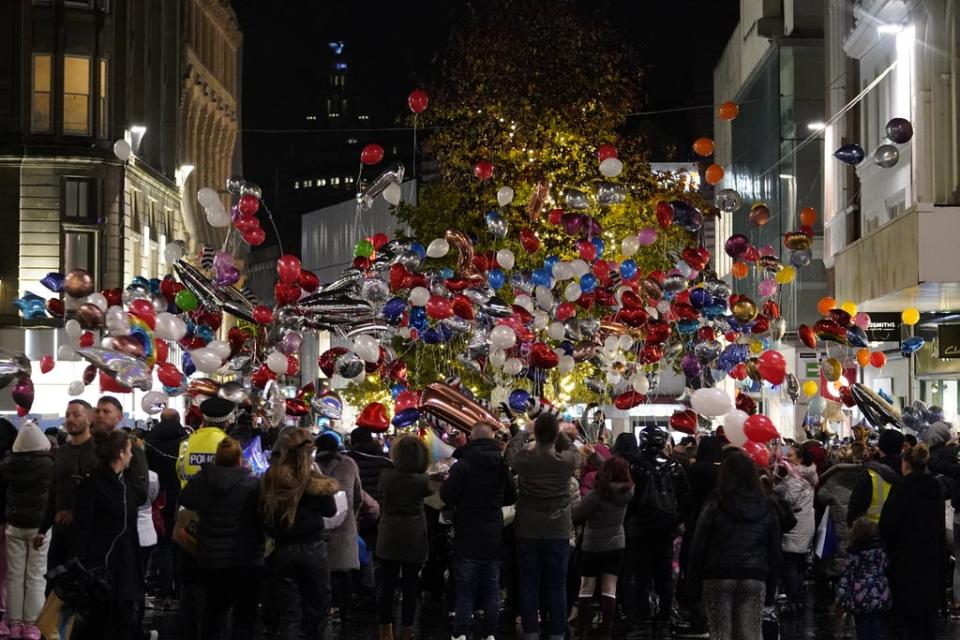 Balloons are released as people take part in a vigil in Liverpool city centre for 12-year-old Ava White (Danny LAwson/PA) (PA Wire)