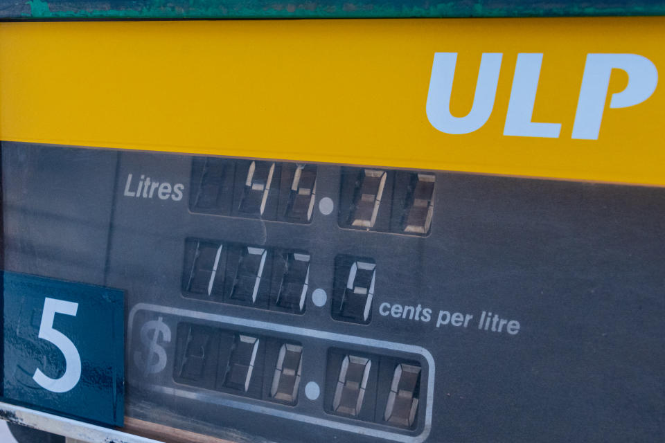 A close-up of a fuel pump showing high prices. (Source: Getty)