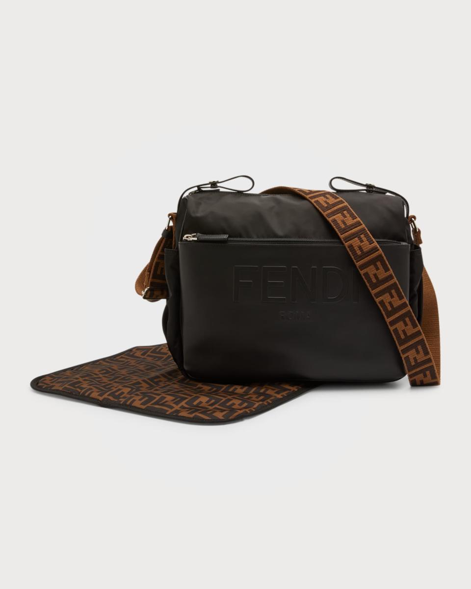 <p><a href="https://www.saksfifthavenue.com/product/fendi-nylon-embossed-logo-diaper-bag-0400014524918.html" rel="nofollow noopener" target="_blank" data-ylk="slk:Shop Now;elm:context_link;itc:0;sec:content-canvas" class="link ">Shop Now</a></p><p>FF Logo Diaper Bag w/ Changing Pad</p><p>saksfifthavenue.com</p><p>$1590.00</p><span class="copyright">neimanmarcus.com</span>