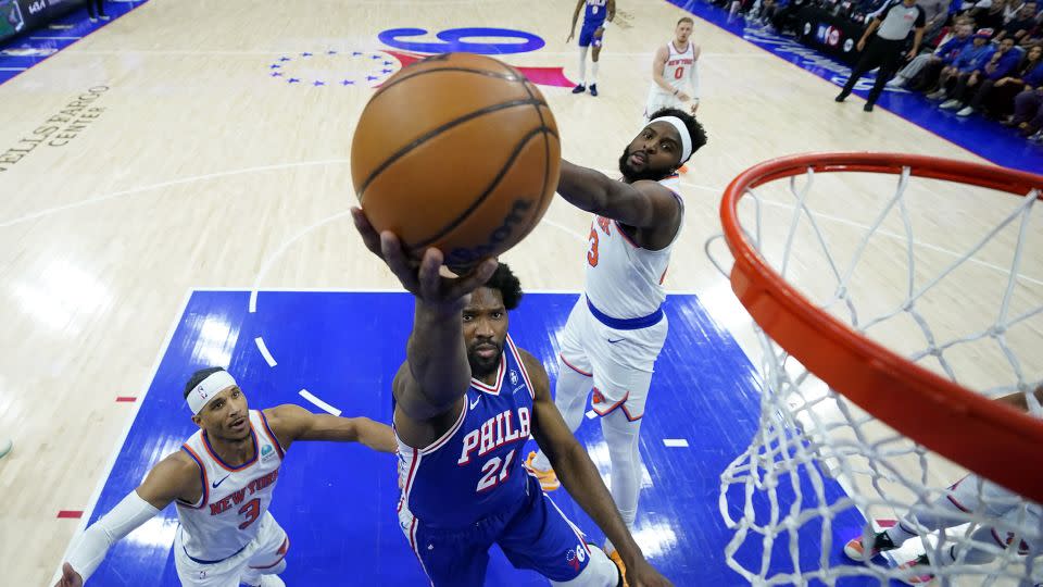 Embiid drives to the rim during the game. - Matt Slocum/AP