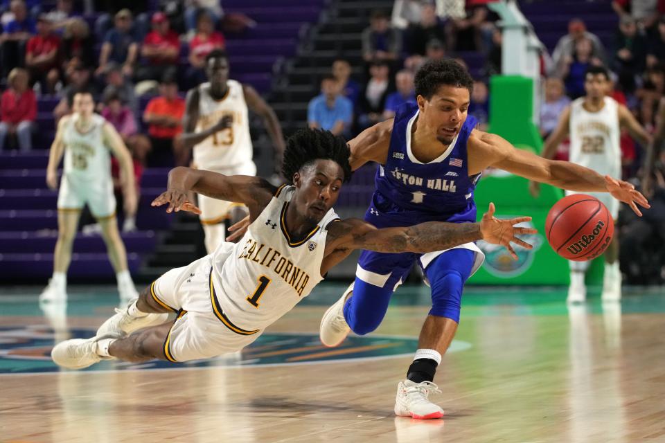 Seton Hall Pirates guard Bryce Aiken (1) and California Golden Bears guard Joel Brown (1) battle for a loose ball during the first half at Suncoast Credit Union Arena.