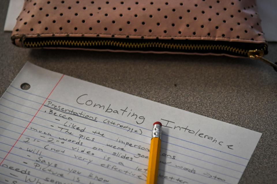 A student takes notes in Julia Braxton's Combating Intolerance class at McLean High School on Friday, September 27, 2019, in McLean, VA. Combating Intolerance has been offered at a handful of Fairfax County high schools, but this is the first time the class is being offered at McLean High School.
