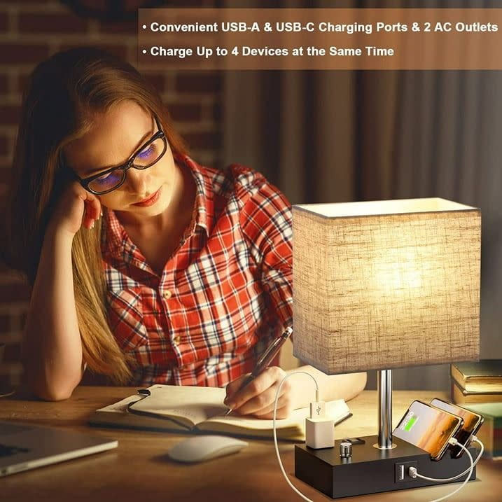 <p><a href="https://go.redirectingat.com?id=74968X1596630&url=https%3A%2F%2Fwww.walmart.com%2Fip%2FBedside-Table-Lamp-Bedroom-Dual-Fast-USB-Charging-Ports-Fully-Dimmable-Nightstand-Lamps-2-Phone-Stands-Outlets-Desk-lamp-Fabric-Shade-Living-Room%2F1552631915&sref=https%3A%2F%2Fwww.goodhousekeeping.com%2Fhome-products%2Fg60357640%2Fbest-table-lamps%2F" rel="nofollow noopener" target="_blank" data-ylk="slk:Shop Now;elm:context_link;itc:0;sec:content-canvas" class="link rapid-noclick-resp">Shop Now</a></p><p>Table Lamp With Charging Ports</p><p>walmart.com</p><p>$29.99</p>