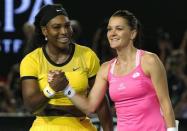 Serena Williams of the U.S. (L) and Poland's Agnieszka Radwanska shake hands after Williams won their semi-final match at the Australian Open tennis tournament at Melbourne Park, Australia, January 28, 2016. REUTERS/Tyrone Siu