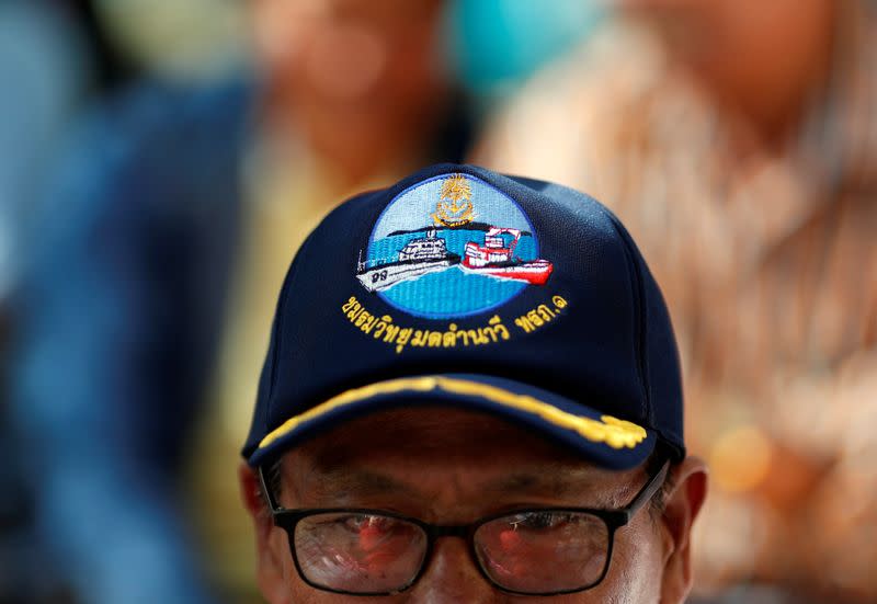 Man sits at a protest outside the Agriculture Ministry in Bangkok