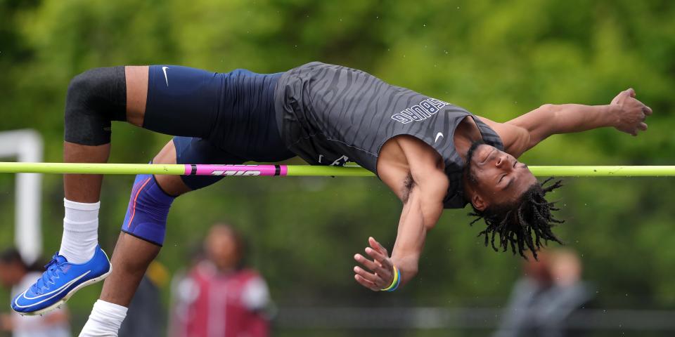 Derrick Pou of Twinsburg clears a bar set at 6 feet, 4 inches to win the boys high jump event during the Division I district track meet at Nordonia High School, Friday, May 17, 2024, in Macedonia, Ohio.