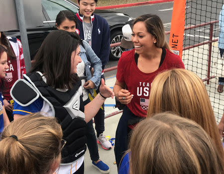 Student Hannah August (L), shares a laugh with U.S. National Softball Team catcher Sahvanna Jaquish, during a visit to Agoura High School, in Agoura Hills, California, U.S., December 17, 2018. REUTERS/Rory Carroll