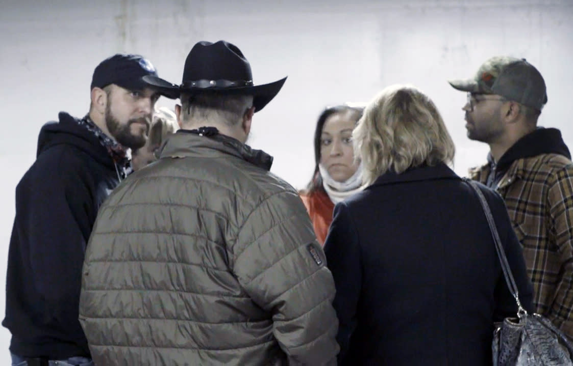 Image: In a screengrab made from video, Stewart Rhodes of the Oath Keepers, wearing a cowboy hat, and Enrique Tarrio, right, in a garage in Washington on the night of Jan. 5, 2021. (U.S. District Court)