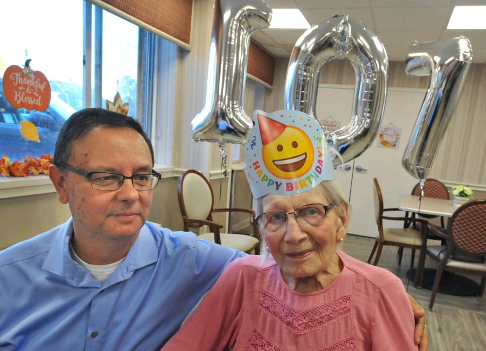 Paul Zaborski, 59, of Rockland, joins his grandmother Jennie Zaborski as she celebrates her 107th birthday at the Webster Park Rehab and Healthcare Center in Rockland on Monday, Nov. 1, 2021.