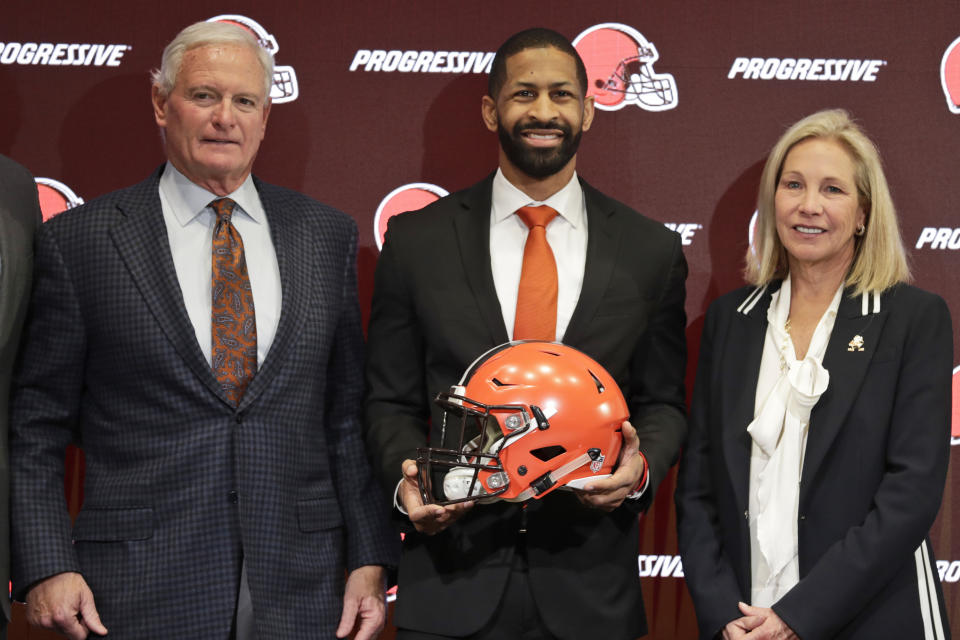 Cleveland Browns general manager Andrew Berry, center, poses for a photo with owners Jimmy Haslam, left, and Dee Haslam. (AP Photo/Tony Dejak)