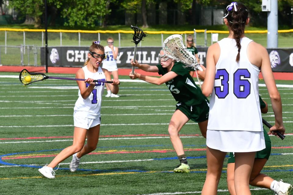 Cherry Hill West freshman Tatum Woods fires a shidearm shot before Mainland junior Jane Meade can slide to help