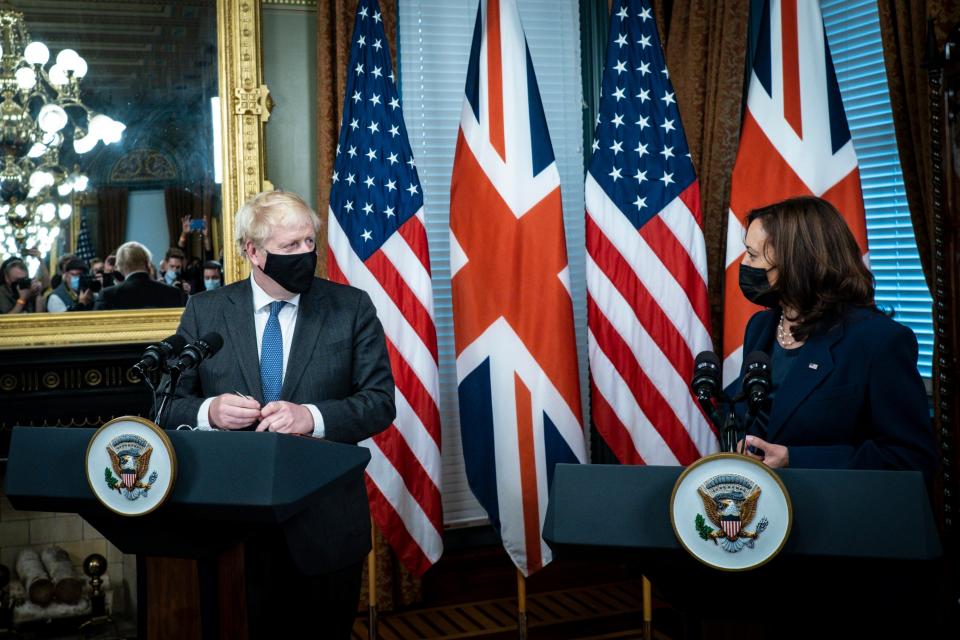 US Vice President Kamala Harris (R) and British Prime Minister Boris Johnson deliver remarks before a meeting, in the Vice President's Ceremonial Office in Washington, DC (EPA)