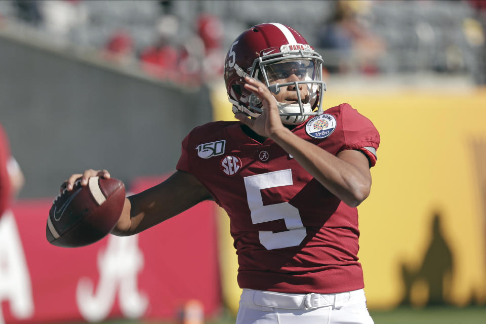 Alabama quarterback Taulia Tagovailoa (5) warms up before the Citrus Bowl NCAA college football game against Michigan, Wednesday, Jan. 1, 2020, in Orlando, Fla. (AP Photo/John Raoux)