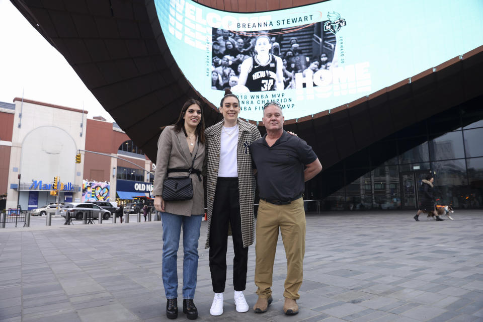 New York Liberty forward Breanna Stewart poses with family in front of Barclays Center before a WNBA basketball news conference, Thursday, Feb. 9, 2023, in New York. (AP Photo/Jessie Alcheh)