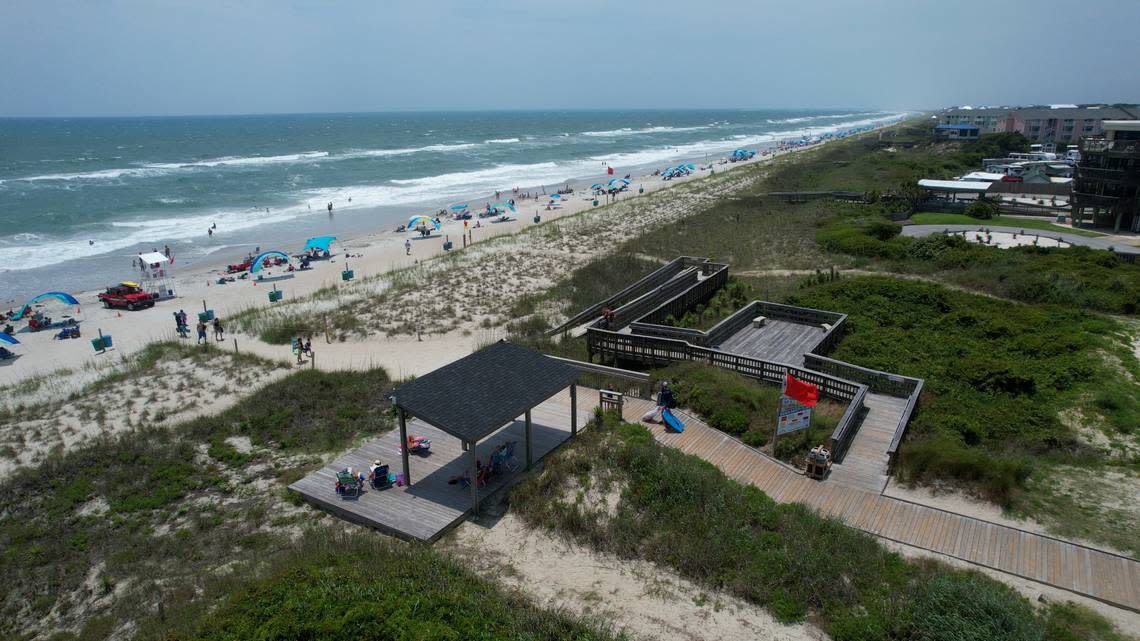 A red flag indicates high risk of powerful currents and rough surf at the Western Ocean Region Access in Emerald Isle.