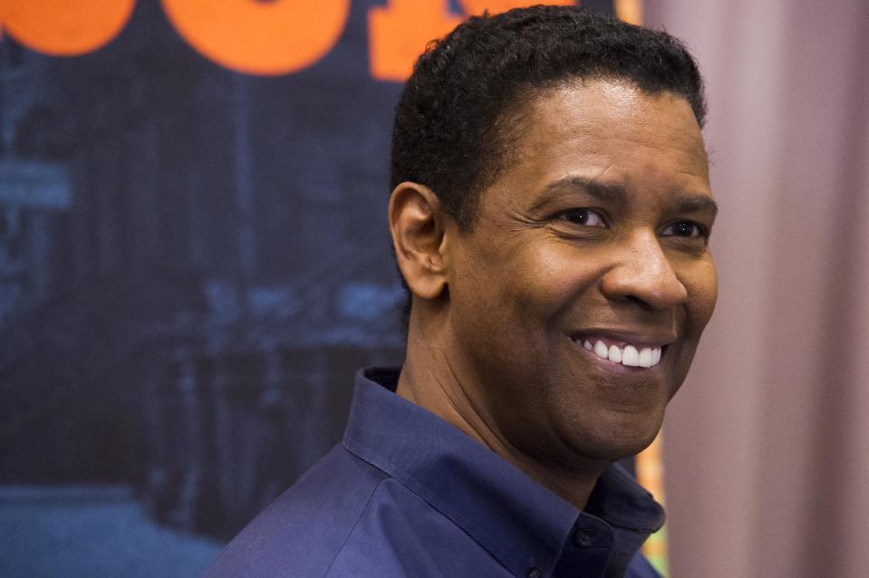 Denzel Washington appears at a press opportunity for the upcoming Broadway production of "A Raisin in the Sun" on Tuesday, Feb. 18, 2014 in New York. (Photo by Charles Sykes/Invision/AP)