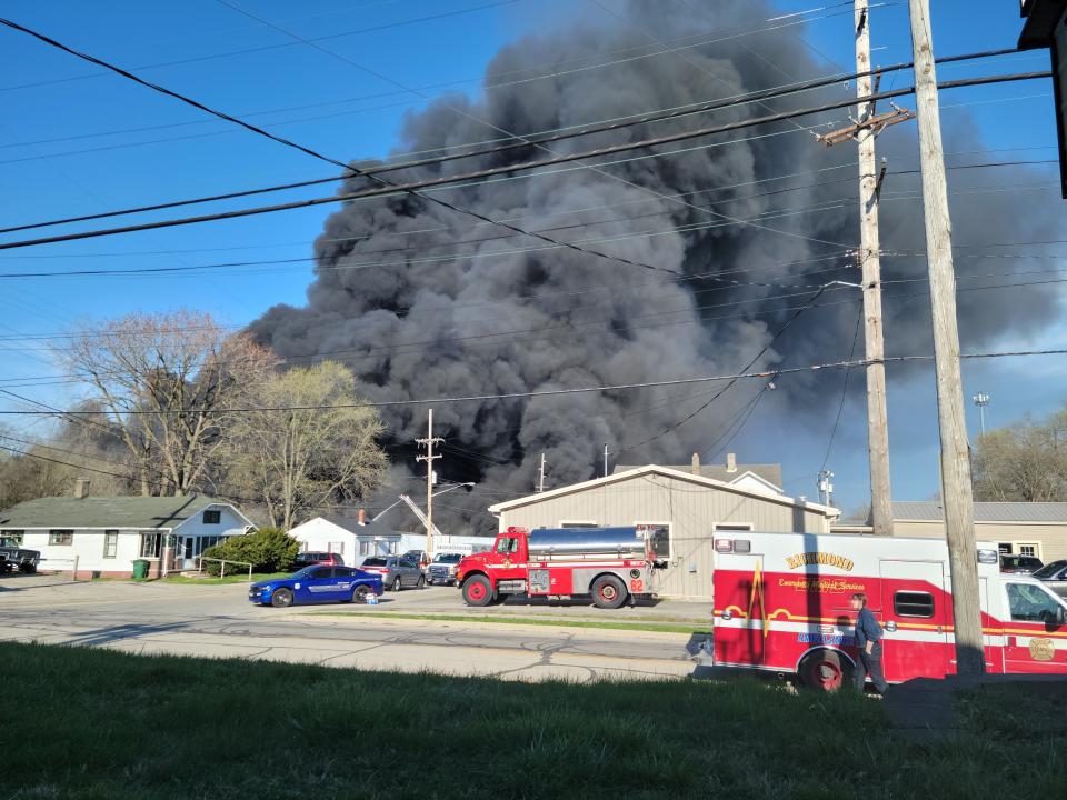 Smoke rises from an industrial fire April 11, 2023, at 358 NW F St. in Richmond.