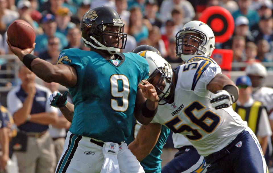 Jacksonville Jaguars quarterback David Garrard (9) gets ready to release a pass in the first quarter before getting hit by San Diego Chargers linebacker Shawne Merriman (56) at Jacksonville Municipal Stadium on Sunday, November 18, 2007. The Jaguars won 24-17.  [Don Burk, The Florida Times-Union]